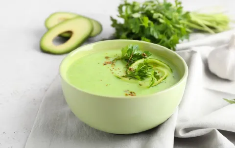 Good for your heart avocado soup in green bowl